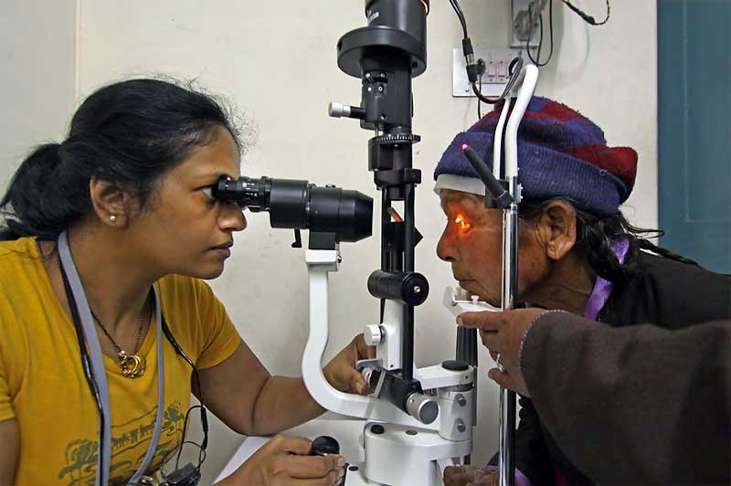 Dr. Ranjana examining a patient prior to cataract surgery